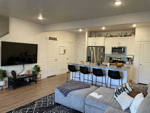 Living room with wood-type flooring