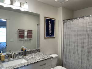 Bathroom featuring toilet and vanity