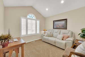 Office off the living room with vaulted ceilings