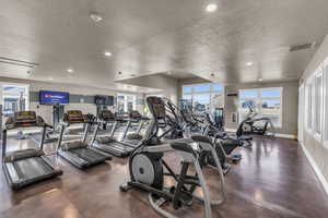 Workout area featuring a textured ceiling