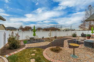 View of yard with cooling unit and a patio