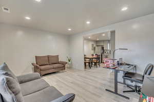 Living room featuring light hardwood / wood-style flooring