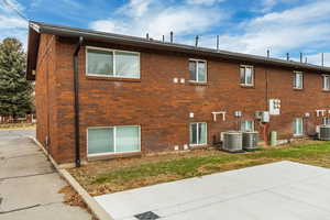 View of home's exterior with a patio area and cooling units