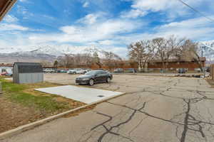 View of car parking featuring a mountain view