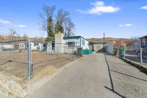 View of front of property featuring a carport