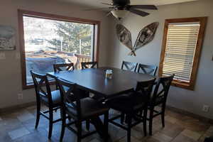 Tiled dining area with ceiling fan
