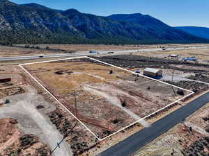 Birds eye view of property featuring a rural view and a mountain view