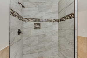 Bathroom with tiled shower