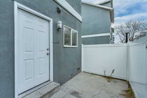 Property entrance featuring a patio