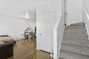 Stairway with hardwood / wood-style flooring