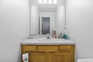 Bathroom featuring vanity and toilet