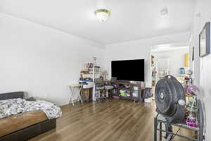 Bedroom with wood-type flooring