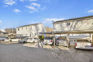 View of parking with a carport