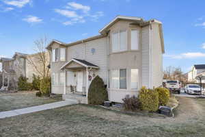 View of front of property featuring a front yard