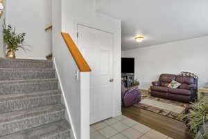 Staircase with tile patterned floors