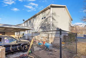 View of property exterior featuring a mountain view