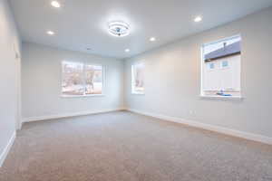 Primary bedroom with carpet flooring, ceiling fan, and mountain views