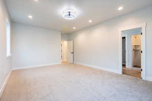 View of carpeted primary bedroom