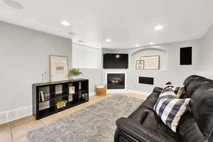 Living room featuring light tile patterned flooring