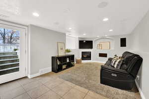 Living room featuring light tile patterned floors