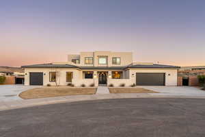 View of front of property with a garage