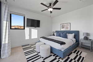 Bedroom with light carpet and ceiling fan