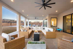 Patio terrace at dusk featuring outdoor lounge area and ceiling fan