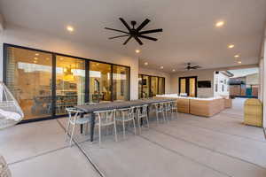 View of patio / terrace featuring outdoor lounge area, an outdoor bar, and ceiling fan