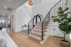 Stairs with hardwood / wood-style floors