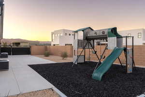 Playground at dusk featuring central air condition unit