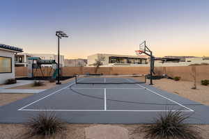 View of basketball court featuring tennis court