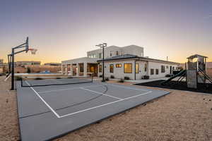 View of sport court with a playground and tennis court