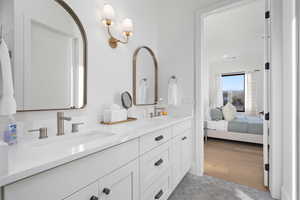 Bathroom featuring vanity and wood-type flooring