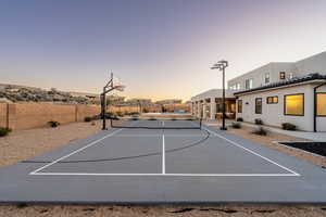 View of sport court featuring tennis court