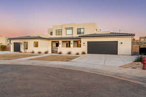 View of front of property featuring a garage