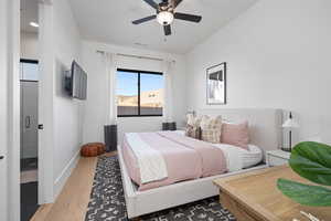 Bedroom featuring wood-type flooring and ceiling fan