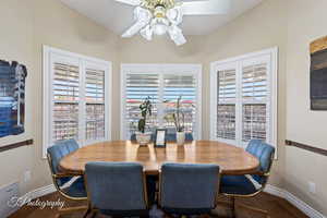 Dining area with a healthy amount of sunlight, hardwood / wood-style floors, and ceiling fan