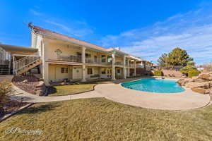 View of pool featuring a yard and a patio area