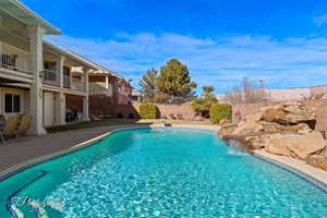 View of swimming pool featuring pool water feature