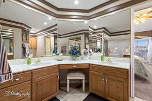 Bathroom featuring vanity, crown molding, tile patterned floors, and toilet