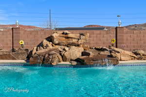 View of swimming pool featuring pool water feature