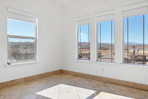 Spare room featuring a mountain view