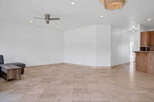 Empty room featuring sink and ceiling fan