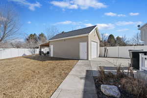 2nd covered patio behind the 4th car detached garage. This gives your renters their own patio.