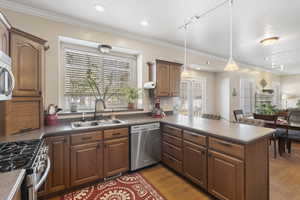 Spacious kitchen with large window shelf over the sink. Perfect place to grow your own herbs or favorite plants while looking into your backyard.