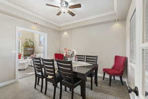 Formal dining room just off of the kitchen looking into the sitting room.