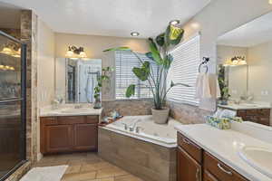 Corner jetted tub in Primary bathroom. The windows keep this bathroom light and bright.