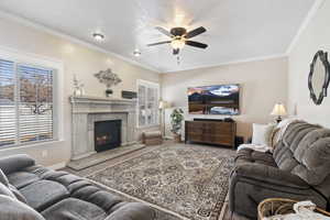 The great room. This is a large open space with a fireplace. GREAT ENTERTAINMENT SPACE as it is open to the kitchen and looks out to the backyard.