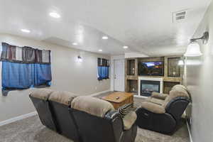 THE APARTMENT in the basement family room showing the door that leads out to the detached 4th garage and covered patio.