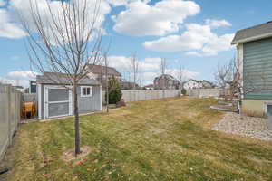 View of yard featuring a storage shed